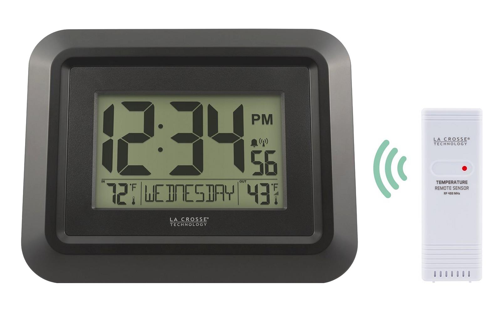 Analogue wall clock with digital thermometer and hygrometer